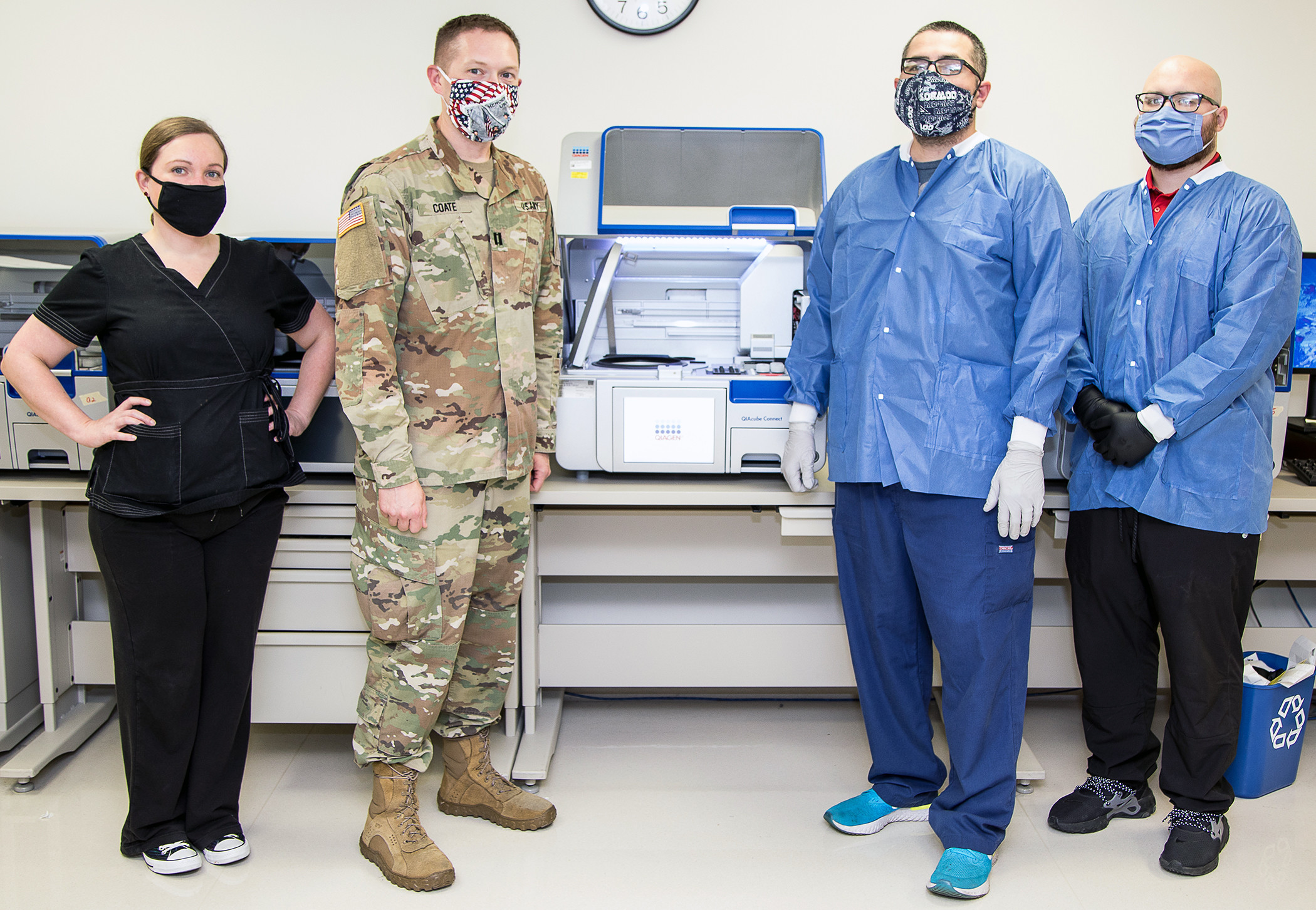 Molecular team members demonstrate molecular ribonucleic acid extraction equipment at Brooke Army Medical Center, Fort Sam Houston, Texas, June 1, 2020. BAMC is actively paving the way for patients to know whether or not they have the virus in a timely manner. (U.S. Army photo by Senior Master Sgt. Sarah Hanaway)